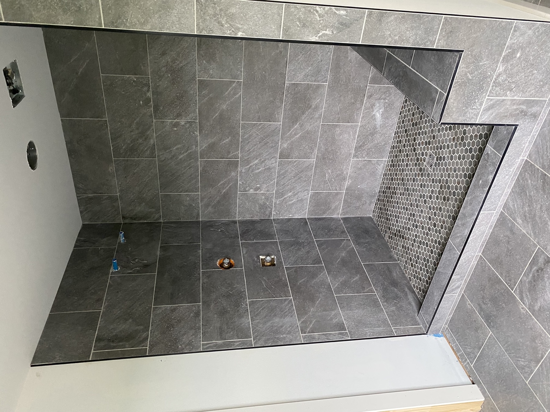 Custom shower · hex floor & bench