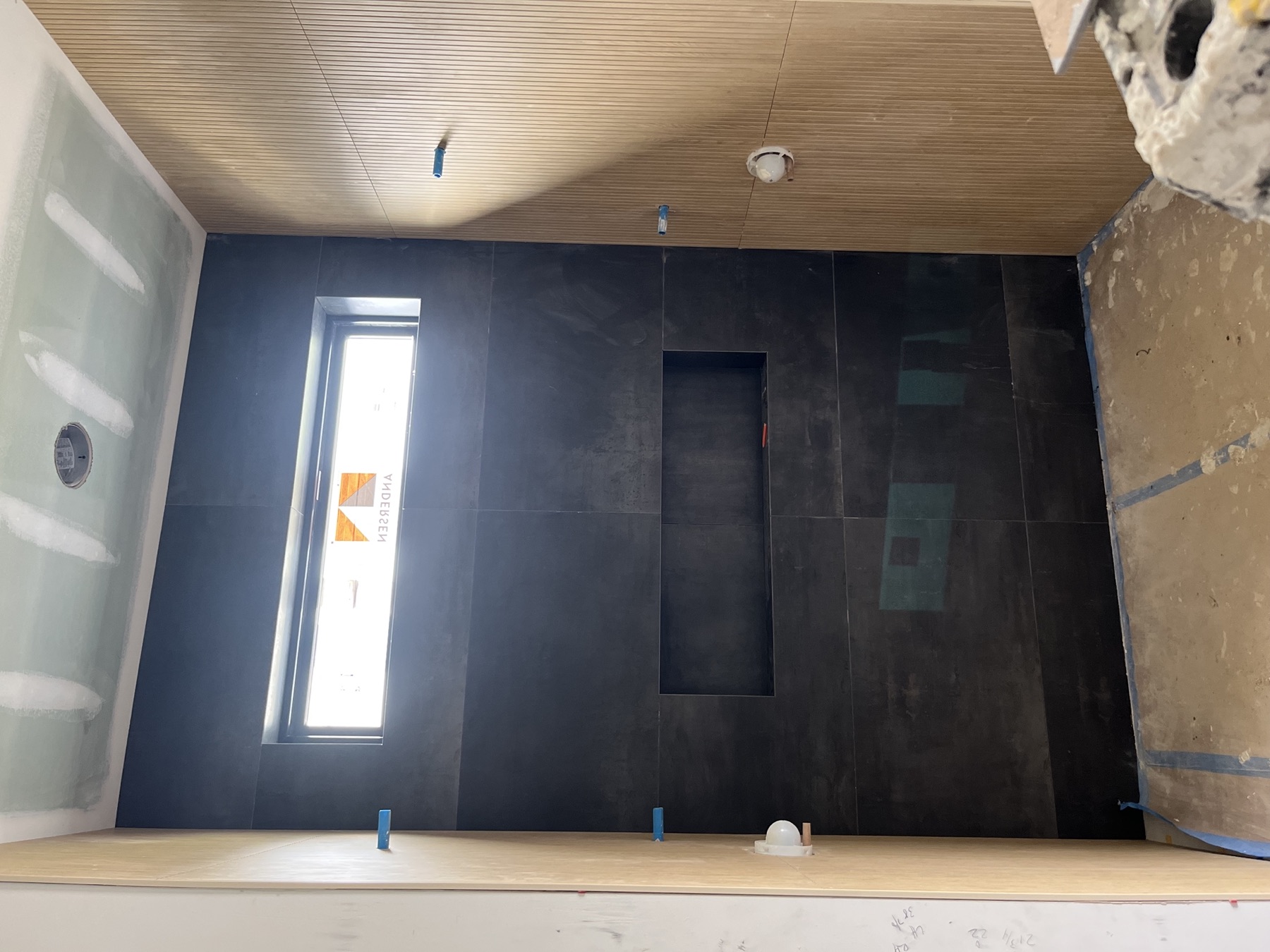 Custom shower · charcoal tile & fluted walls