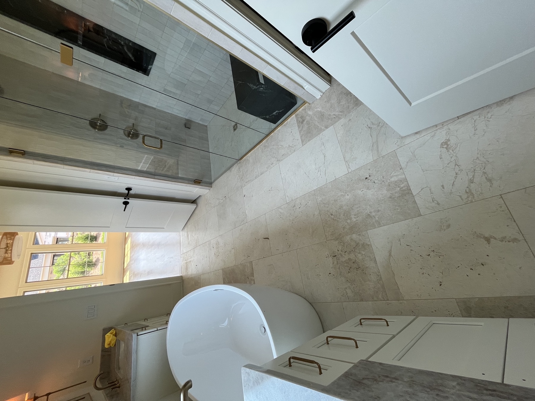 Luxury bathroom remodel with glass shower and freestanding tub